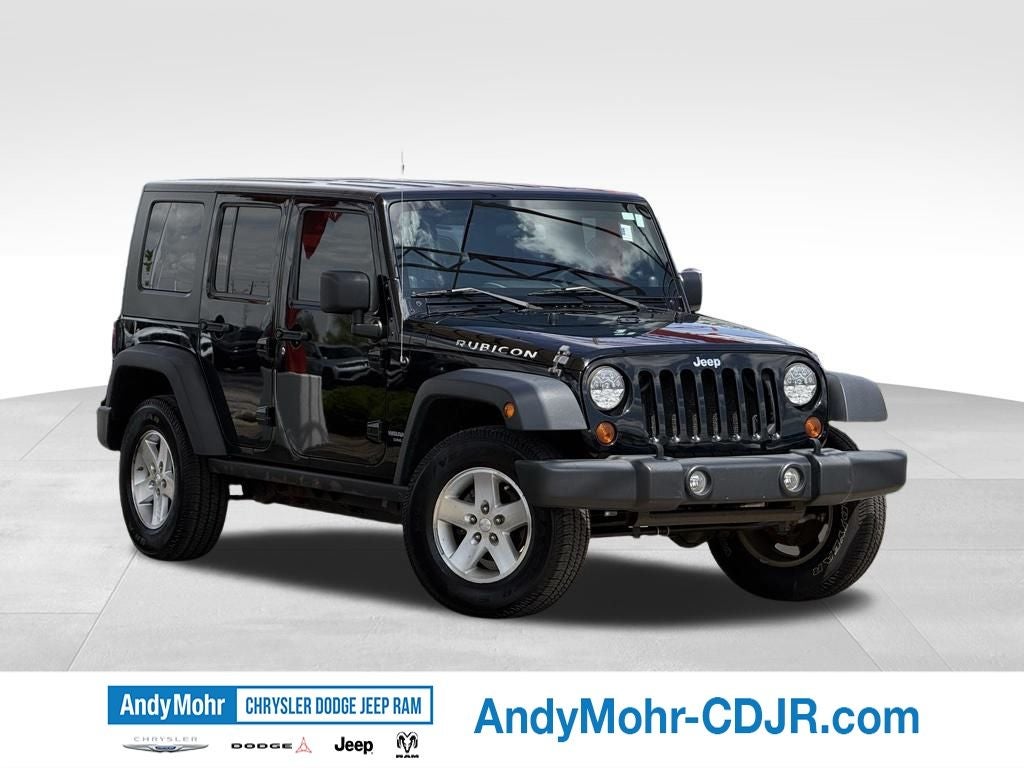 2009 Jeep Wrangler Unlimited Unlimited Rubicon in Black Clearcoat — front three-quarter view