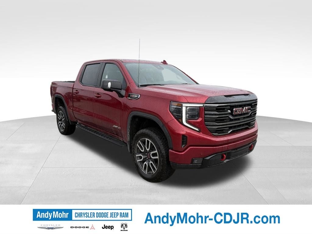 2026 GMC Sierra 1500 AT4 in Volcanic Red Tintcoat — front three-quarter view